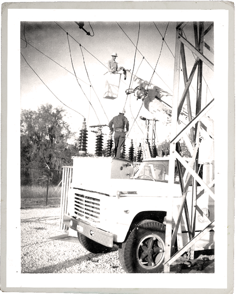 A line crew repairs power lines